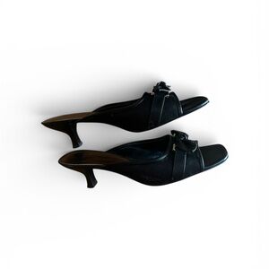 Etienne Aigner mule sandals with a bow detail